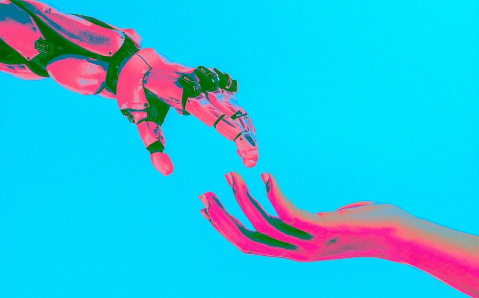 An over-saturated image of a human hand reaching out to a robotic arm.